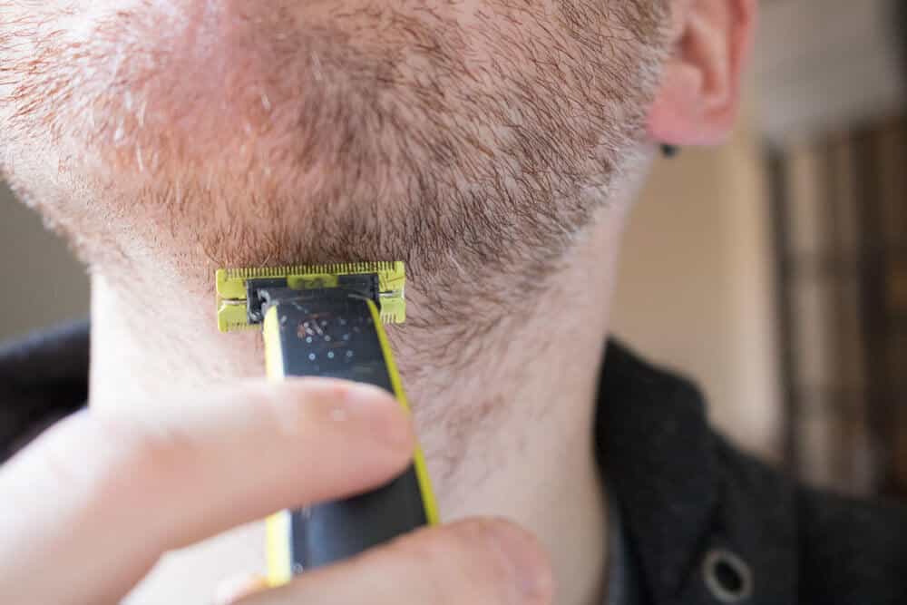 view of neck while trimming hair