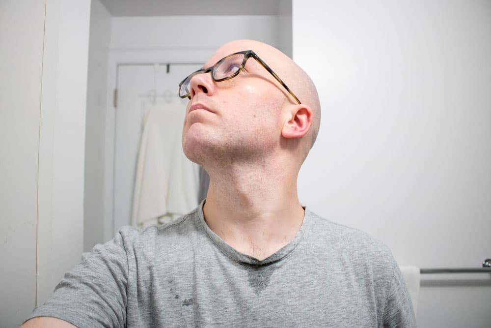 man looking up to the left demonstrating results of shaving cream