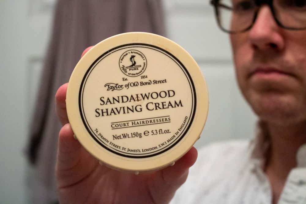 man holding taylor of old bond street shaving cream