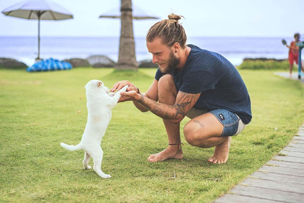 man and puppy